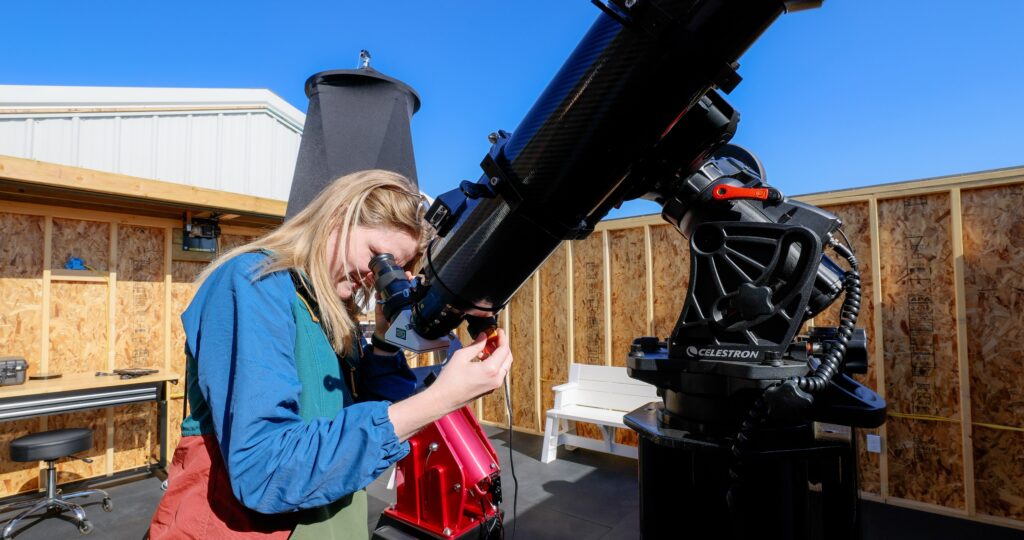 Visitor using the solar telescope at the Montana Learning Center