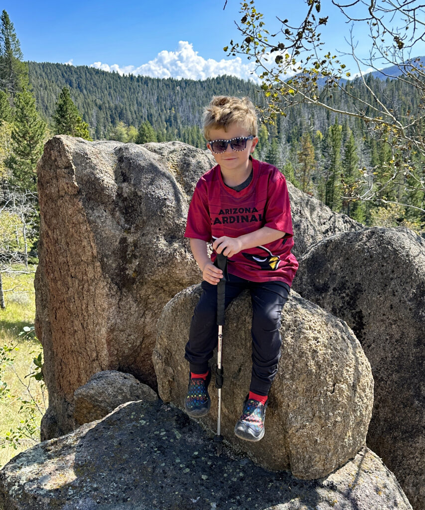 Six Year Old Sawyer Trapp Sitting on Boulders of the Batholith