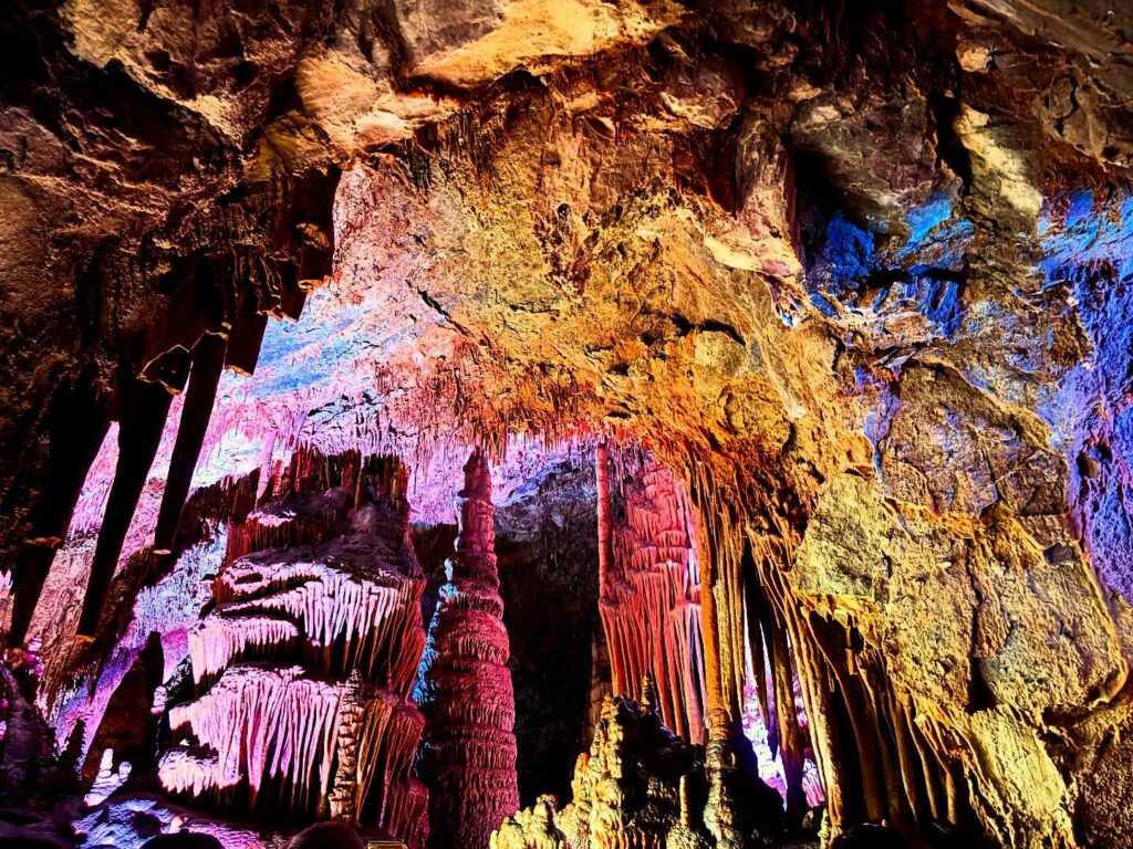 Guided cave tour view of limestone formations in Lewis and Clark Caverns State Park, near Whitehall, Montana. Stalactites, stalagmites, and colorful cavern chambers in Southwest Montana. Photo by @kr.travelphotos on Instagram.